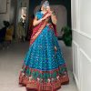 Glamorous Sky Blue Color Tussar Silk Drawstring & Printed With Foil Print & Heavy Tassels Lehenga Choli