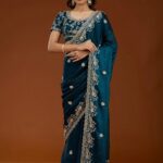 E BT 438 Teal in Fandy Satin Silk mbroidery Work & Zari Work Saree. Special Price ₹1949. Delivery 4-6 Working Days. Shop now. | Designer Sarees, Embroidered Sarees, Sarees, Bollywood Sarees, Creative Sarees, Ethnic Saree, Modern Digital sarees, Party Wear Sarees