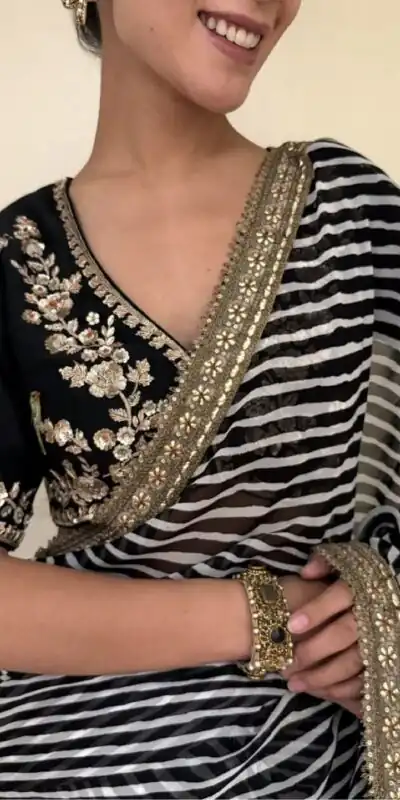 NC 5553 Black Faux Georgette Saree Perfect for Wedding, Party, Bridal Wear, Baisakhi, Raksha Bandhan –. Introductory Price ₹1899. Delivery 4-6 Workin | Designer Sarees, Sarees, Bollywood Sarees, Creative Sarees, Embroidered Sarees, Ethnic Saree, Modern Digital sarees, Party Wear Sarees