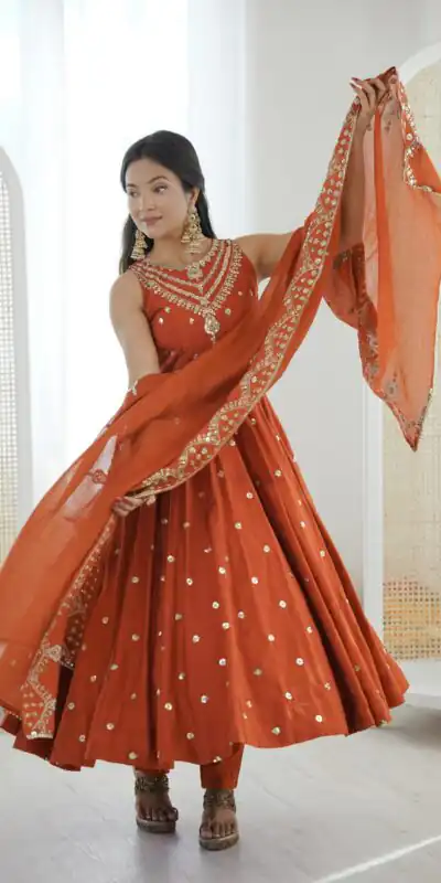 JF 038 Rust Roman Silk Gown with Embroidery Work. Wedding, Party, Festive, Events, Navratri, Exclusive Offer ₹2149. Delivery 4-6 Working Days. Shop now. | Gowns, Bollywood Gowns, Creative Gowns, Designer Gowns, Embroidered Gowns, Party Wear Gowns