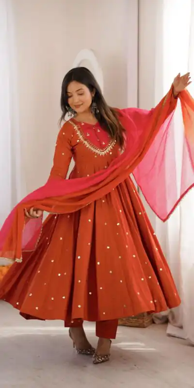 ZF 5023 Rust Roman Silk Gown with Mirror Work & Embroidery Work. Special Price ₹2099. Delivery 4-6 Working Days. Shop now. | Gowns, Bollywood Gowns, Creative Gowns, Designer Gowns, Embroidered Gowns, Party Wear Gowns