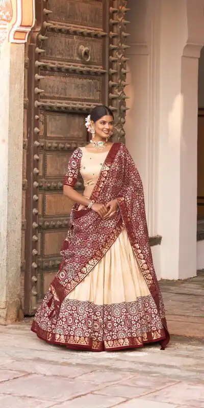 LNB 1614 Off White Color Tussar Silk Dot And Ajarakh & Drawstring With Foil Printed & Heavy Tassels Lehenga Choli   Expected Delivery 4-6 Working Days 2449/- | Lehenga, Bollywood Lehenga, Creative Lehenga, Designer Lehenga, Embroidered Lehenga, Party Wear Lehenga