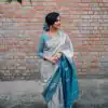 Aesthetically Pleasing Silver Color Soft Lichi Silk Butti Work Saree
