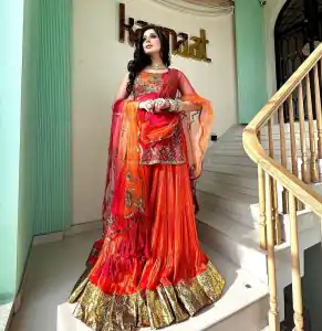 Luminous Orange Georgette Thread Sequence Lehenga Choli